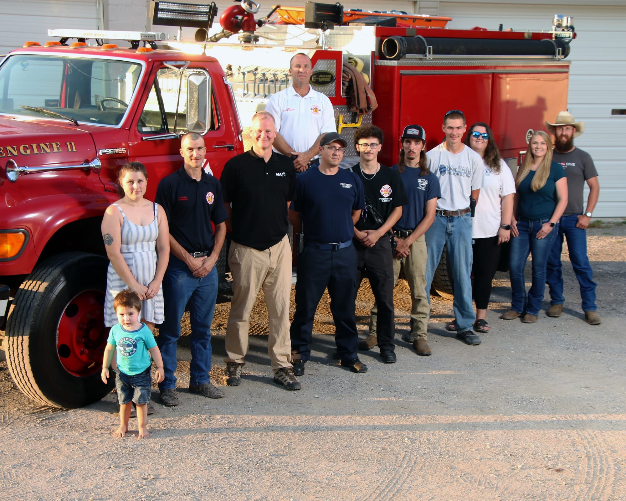 Red Lick VFD members standing in front of Engine 11.