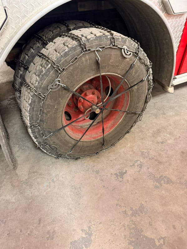 Engine 11 rear tires with snow chains. 